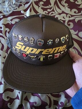 Supreme Brown Trucker Hat with Gold Logo and Pin Badges